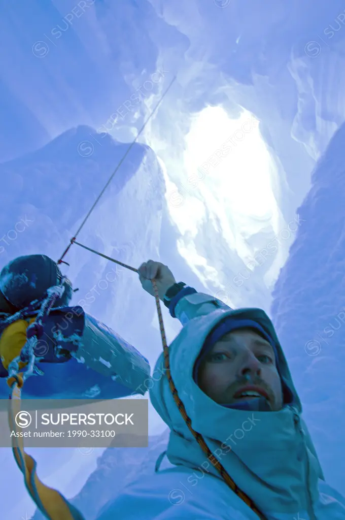 A skier who fell down a crevasse while travelling on a glacier in the Darwin Range, Chile, is in a tricky situation