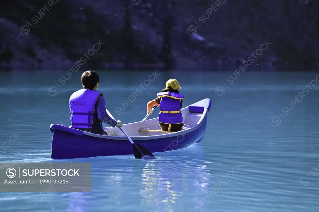 Canoeing on Moraine Lake, Banff National Park, Alberta, Canada.