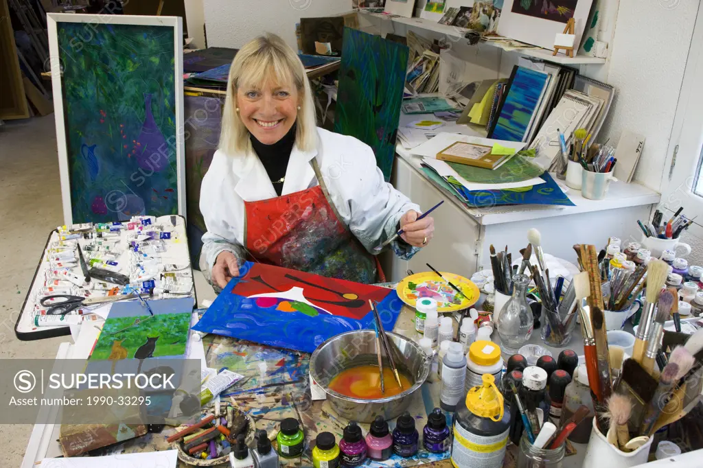 Painting artist in her studio