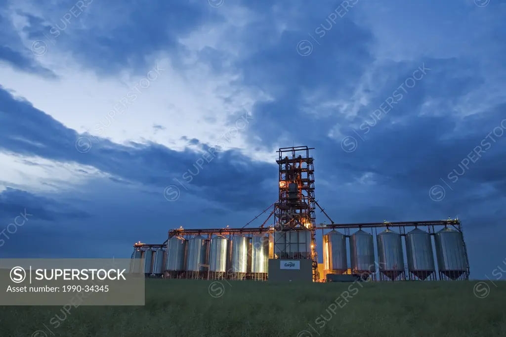 Modern grain elevators, Saskathcewan, Canada at dusk.
