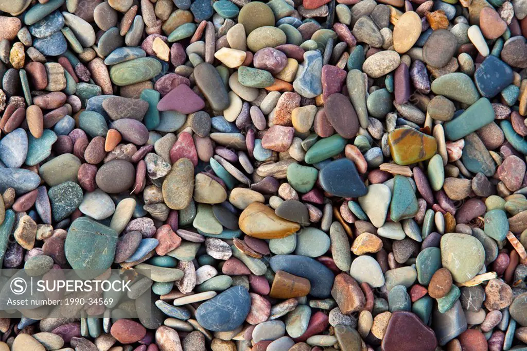 Colourful rocks on the shore of Middle Waterton Lake, Waterton Lakes National Park, Alberta, Canada