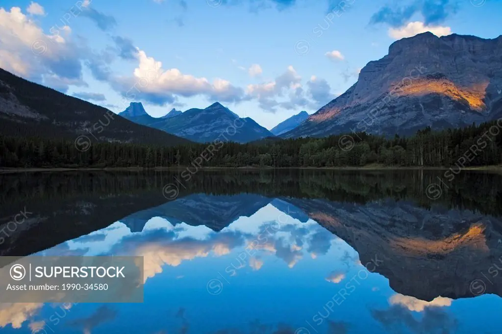 Fortress Mountain and Mount Kidd reflected in Wedge Pond, Kananaskis Country, Alberta, Canada