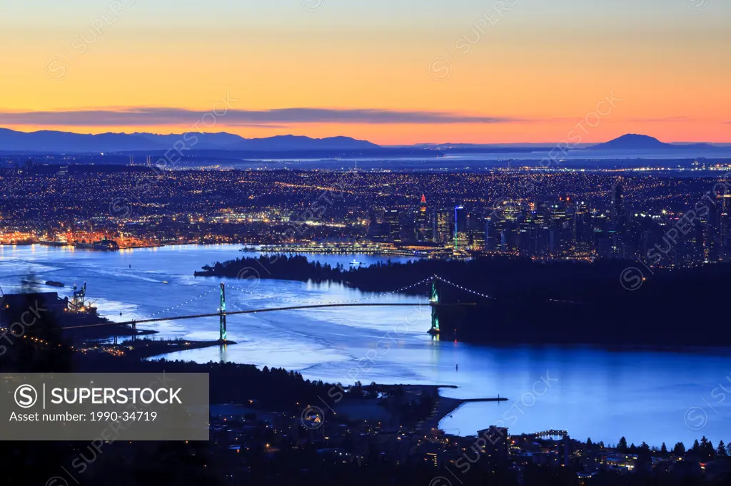 The Vancouver skyline with the Lion´s Gate Bridge and Burrard Inlet at dawn. Vancouver British Columbia Canada