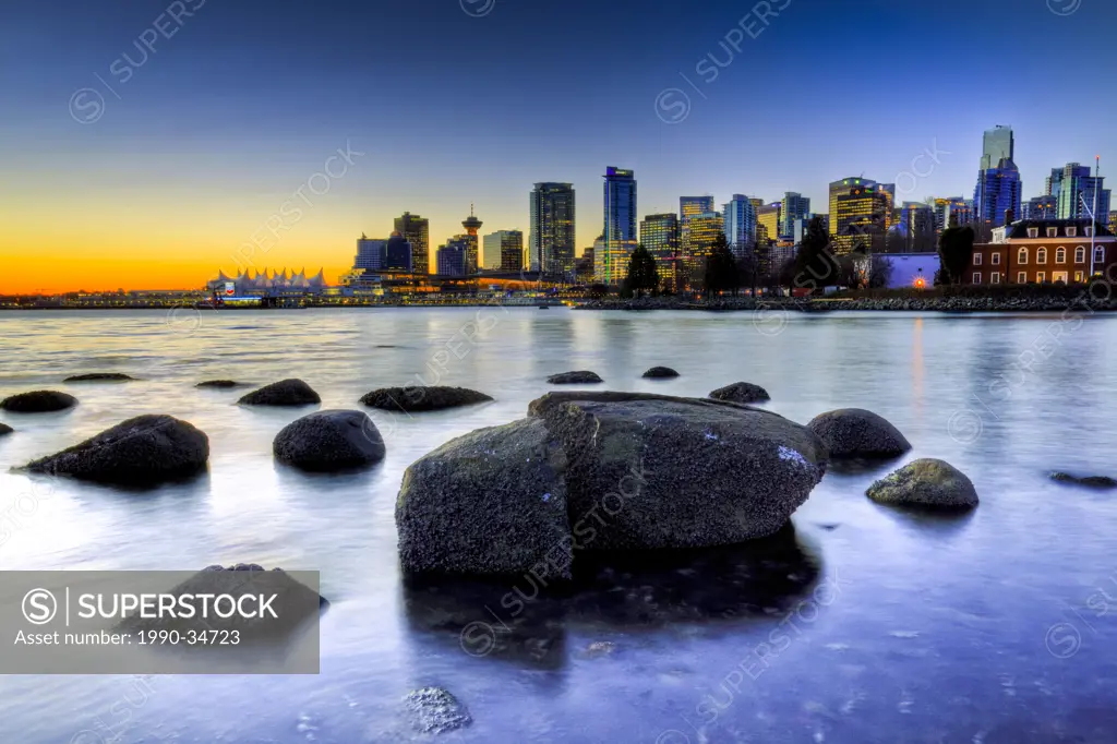 The Vancouver skyline at dawn from Coal Harbor/Harbour. Vancouver British Columbia Canada.