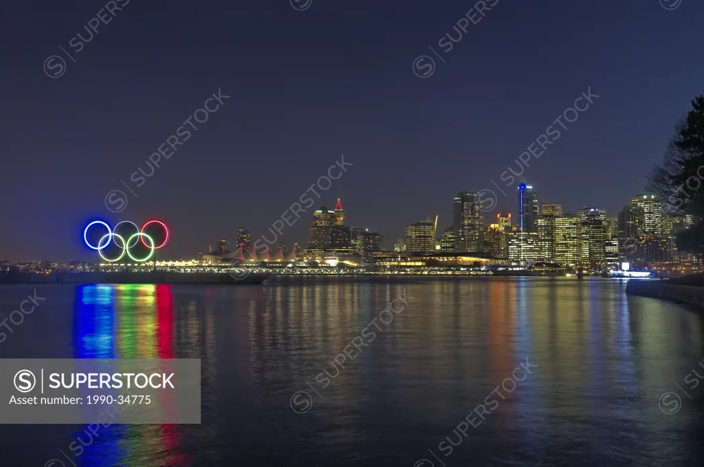 Vancouver skyline with illuminated 2010 Winter Olympic rings, Coal Harbour, Vancouver, British Columbia, Canada