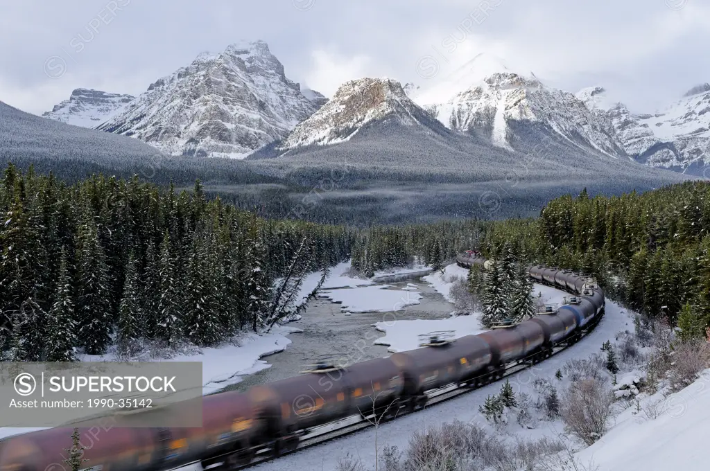 Train at Morant´s curve with Haddo Peak, Saddle Mountain and Fairview Mountain in the background, Banff National Park, Alberta, Canada
