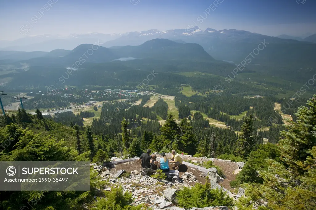 Visitors atop Mount Washington and Comox Glacier in the distance. Mt. Washington, The Comox Valley, Vancouver Island, British Columbia, Canada.