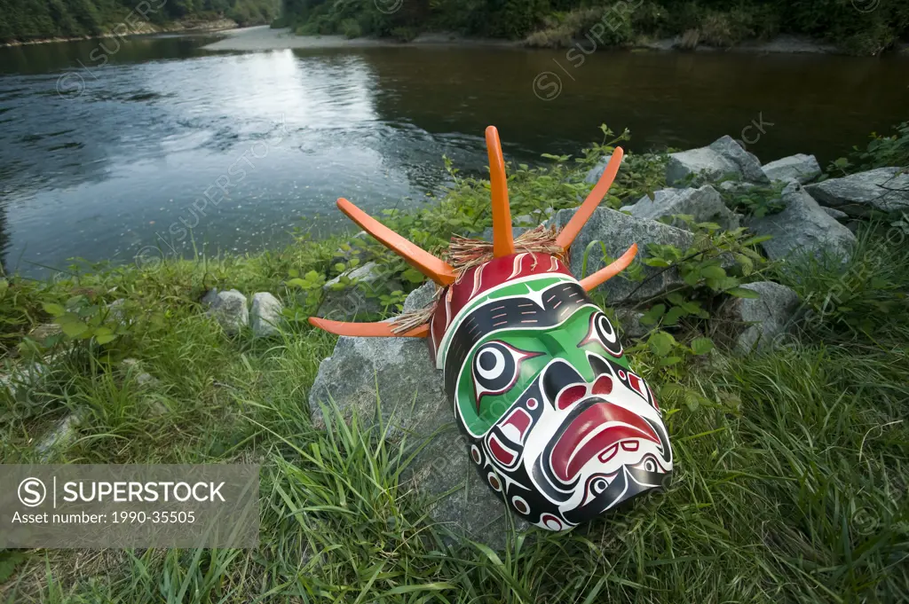 A Native mask on the banks of the Puntledge river in Courtenay, Courtenay, The Comox Valley, Vancouver Island, British Columbia, Canada.