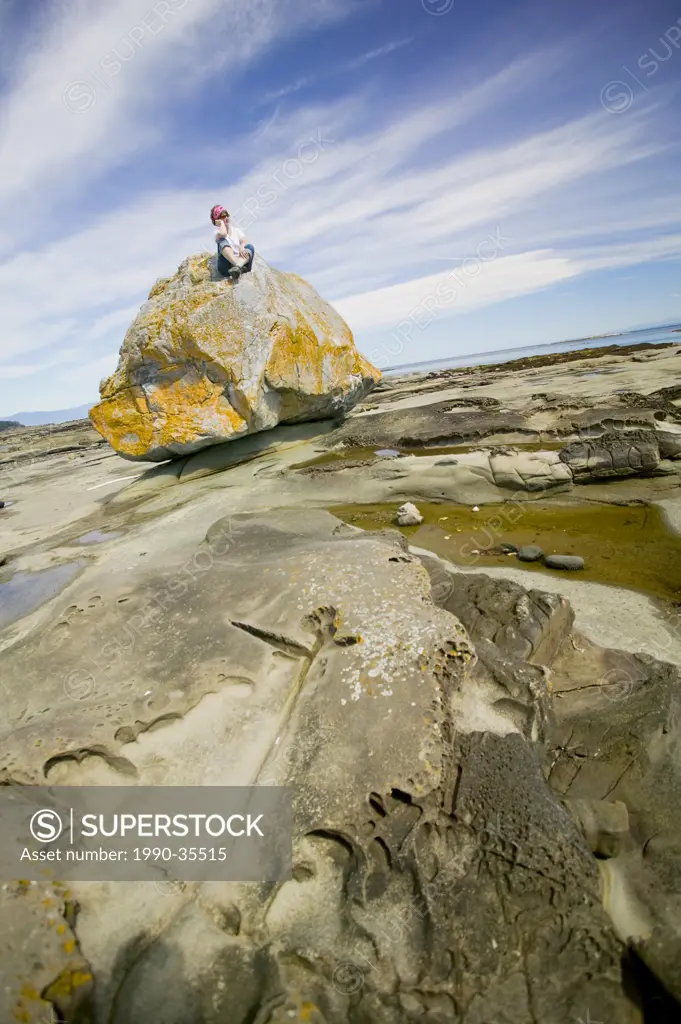 Interesting fock formations and wide open skies make for an interesting walk at low tide along Herron Rocks shores, on Hornby Island. Hornby Island, B...