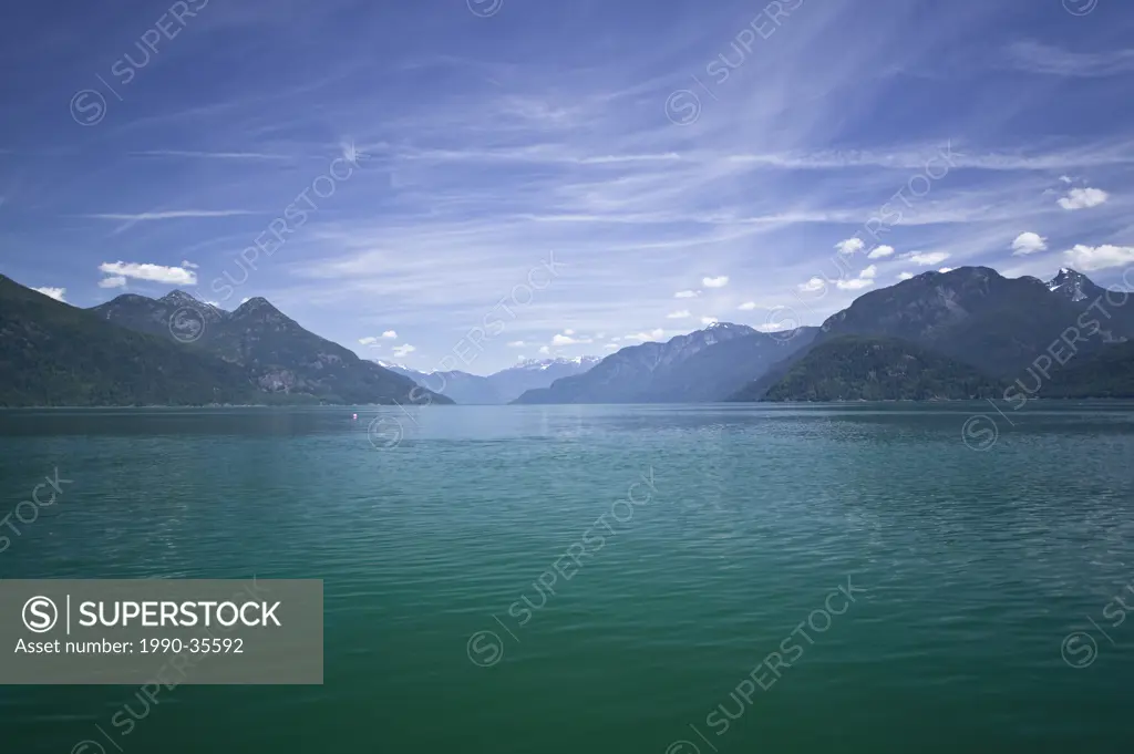 The waters of Bute Inlet turn an emerald green during the spring runoff, where fresh water form the surrounding mountains empties into the salt water....