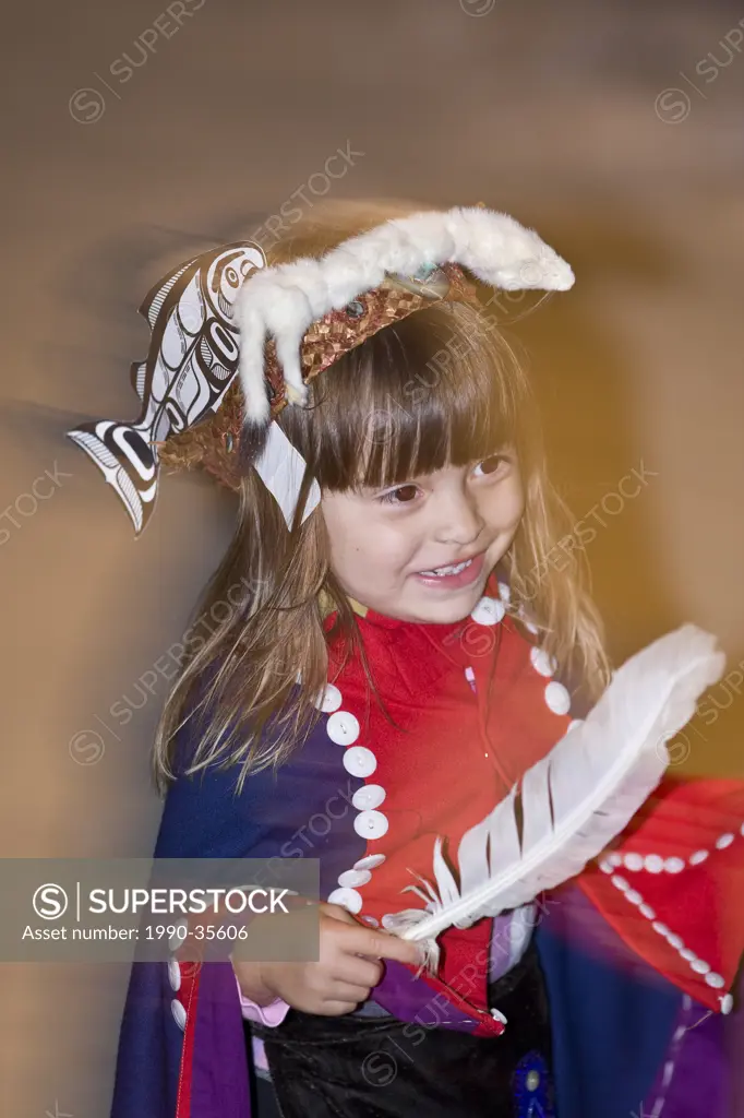 A young Namgi´s dancer in Alert Bay dances the welcome dance for visitors to the longhouse on their reserve. Alert Bay, Northern Vancouver Island, Bri...
