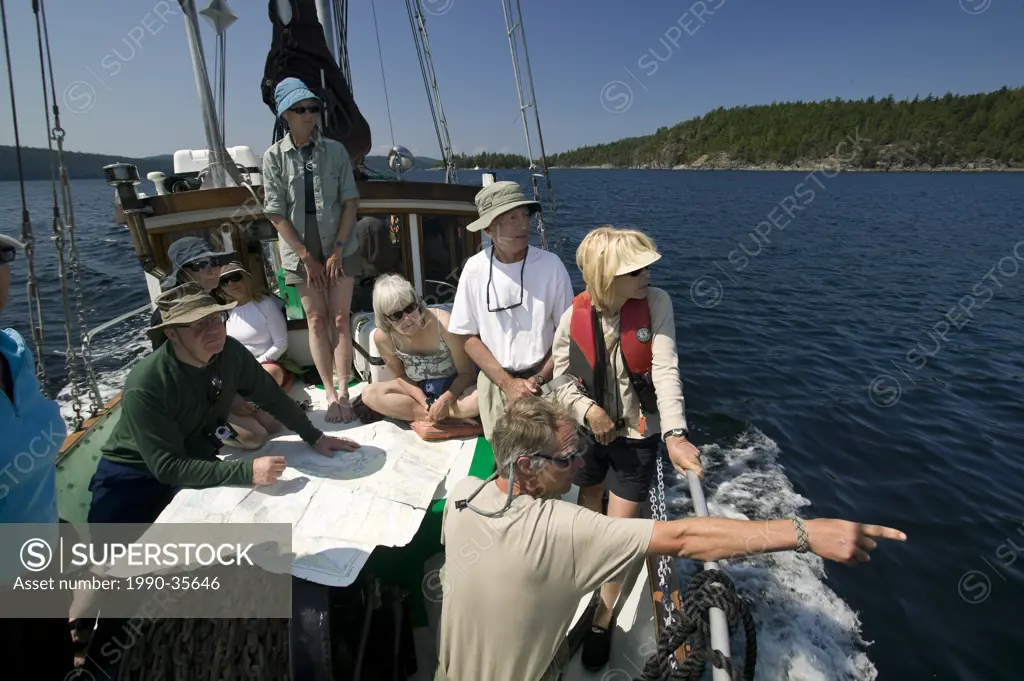 Passengers aboard, Misty Isles, learn from the skipper, tide chart rules and navigational requirements while sailing through Desolation Sound. Desolat...