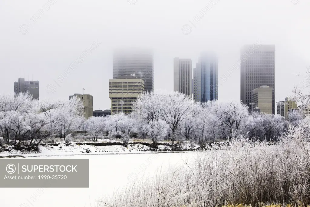Downtown Winnipeg skyline and frozen Red River on a frosty winter day. Winnipeg, Manitoba, Canada.