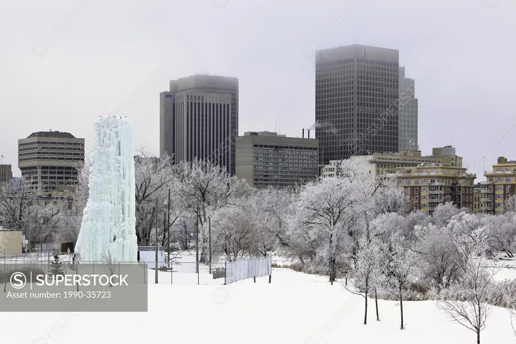Downtown Winnipeg skyline on a frosty winter day. Ice climbing tower in the foreground. Winnipeg, Manitoba, Canada.