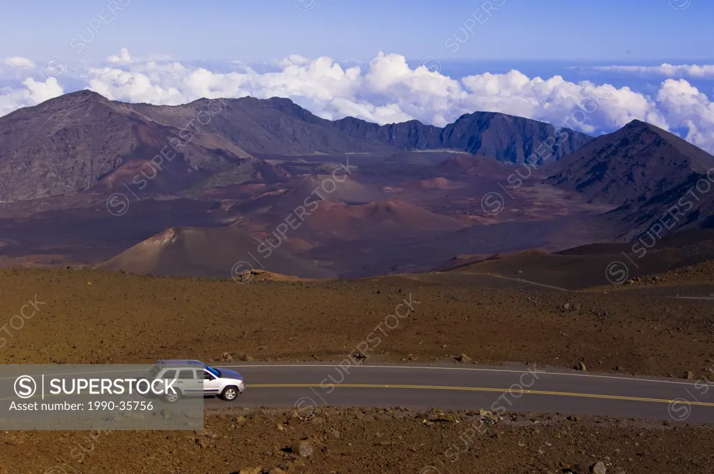 Visitors drive cars up to top of Haleakal volcano, Maui, Hawaii, United States