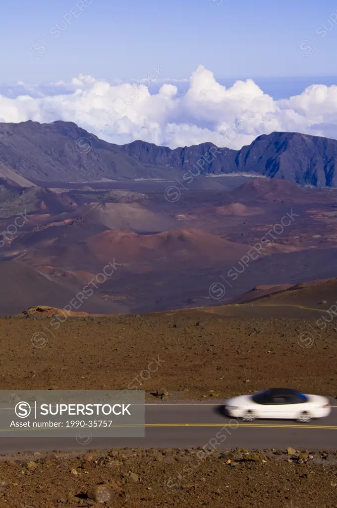 Visitors drive cars up to top of Haleakal volcano, Maui, Hawaii, United States