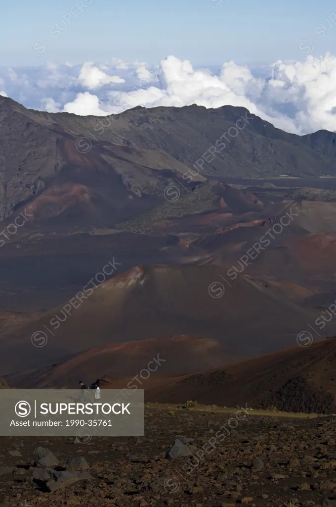 Visitors hike at Haleakal volcano, Maui, Hawaii, United States
