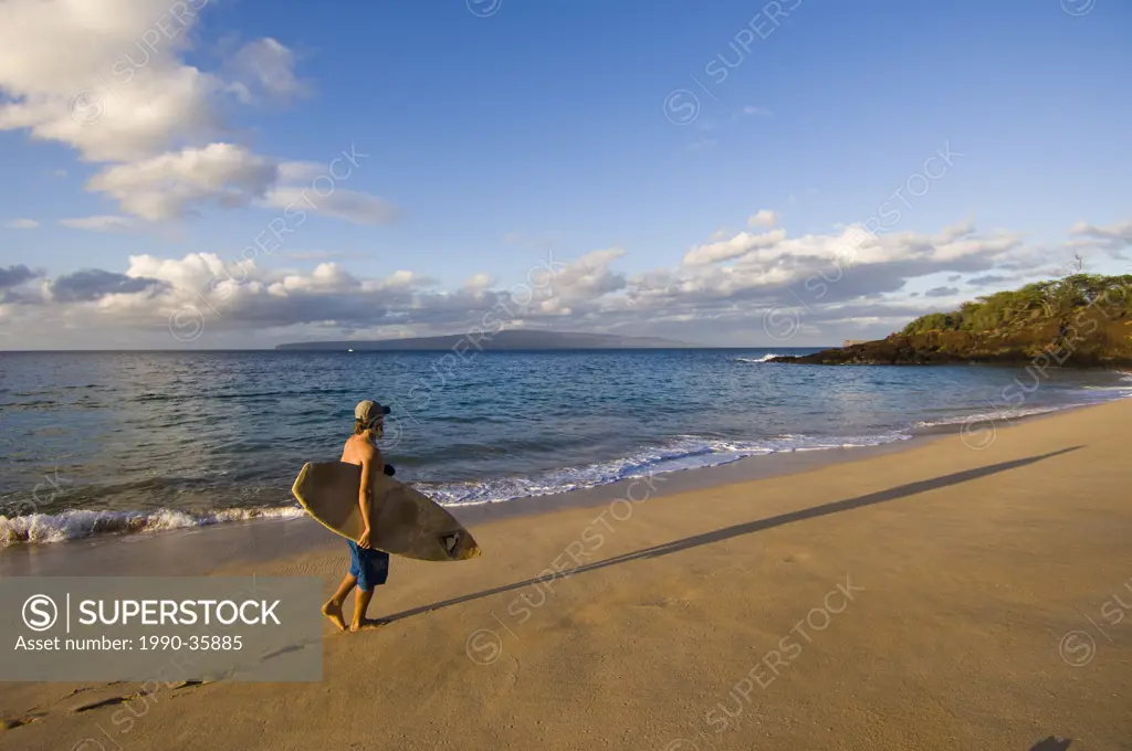 Surfer on Makena Beach or Big Beach, Maui, Hawaii, United States