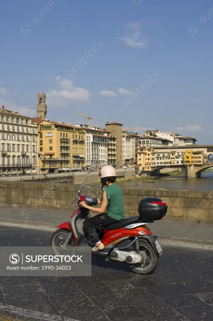 Mopeds crossing the Arno River, Florence, Tuscany, Italy