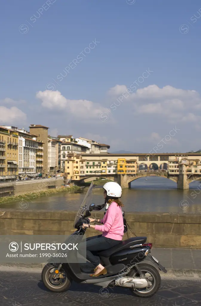 Mopeds crossing the Arno River, Florence, Tuscany, Italy