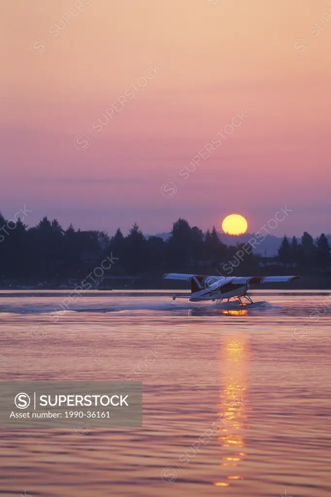 A De Havilland Beaver departs Nanaimo, BC. Protection Island is in the background as the sun rises over Gabriola Island.
