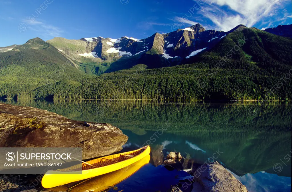 Yellow canoe on Lanezi Lake, Bowron Lake Park, British Columbia, Canada