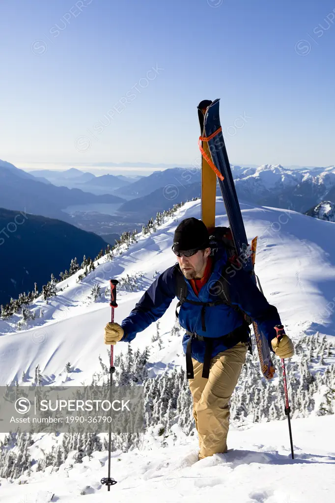 Man hiking on Mount Garibaldi, Coast Mountains, British Columbia, Canada.