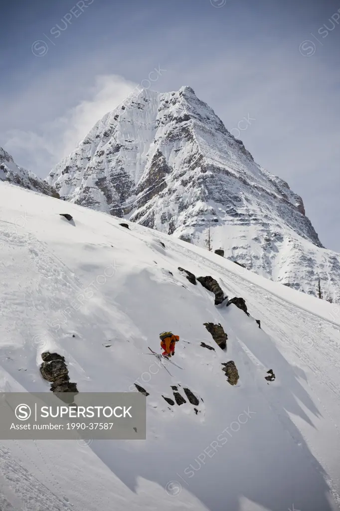 A backcountry skier skiing, Mount Assiniboine Provincial Park, British Columbia, Canada