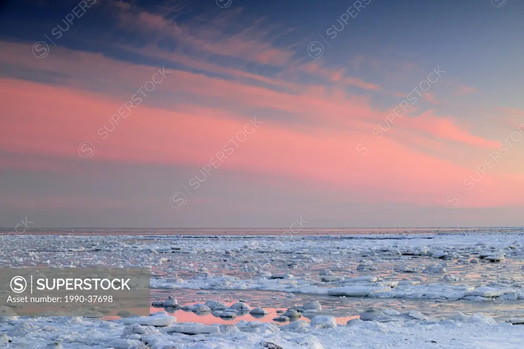 Sunrise skies over Hudson Bay in early winter. Seal River Heritage Lodge, Churchill, Manitoba, Canada.