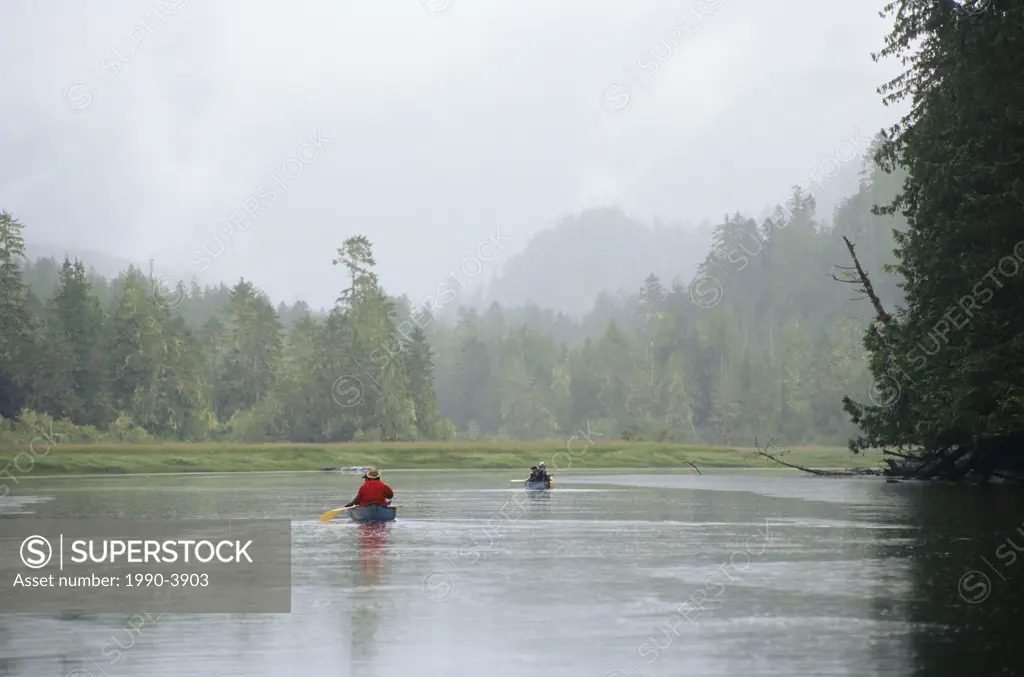 Canoeists travel up the Koeye river in the heart of British Columbias Great Bear Rainforest, British Columbia, Canada