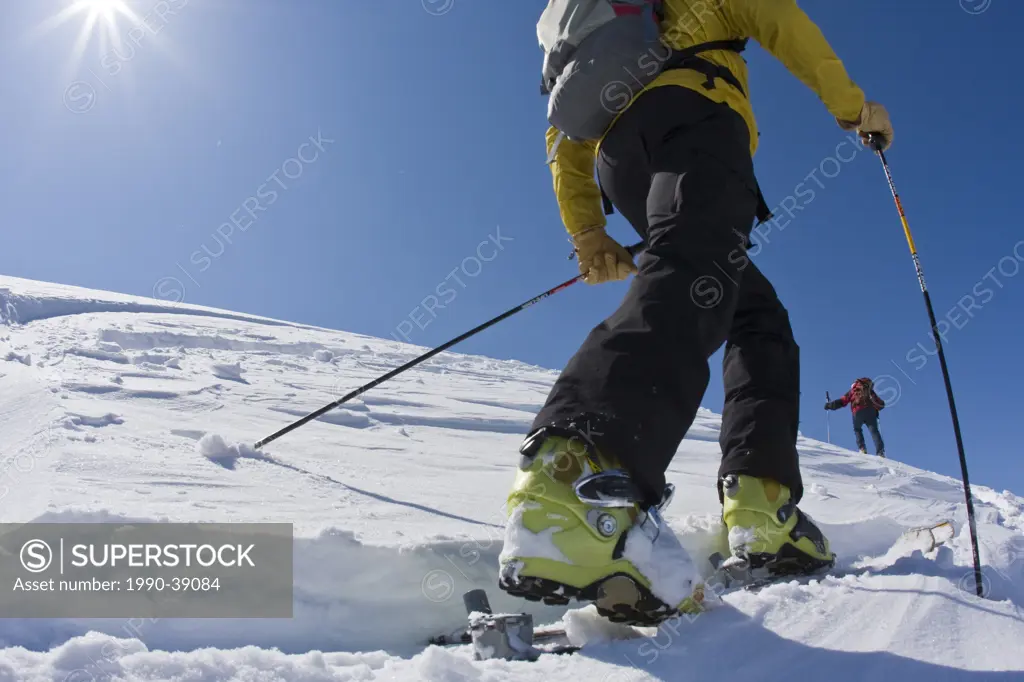 Men backcountry skiing, Parker Ridge, Banff National Park, Alberta, Canada