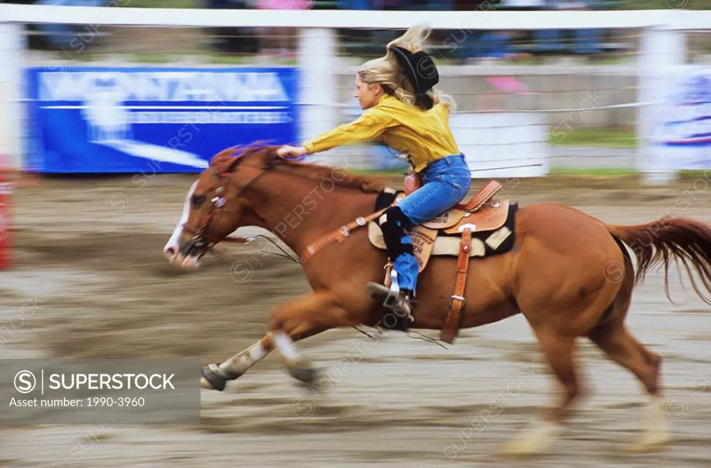 Woman riding a horse at the Luxton Pro Rodeo, Victoria, Vancouver Island, British Columbia, Canada