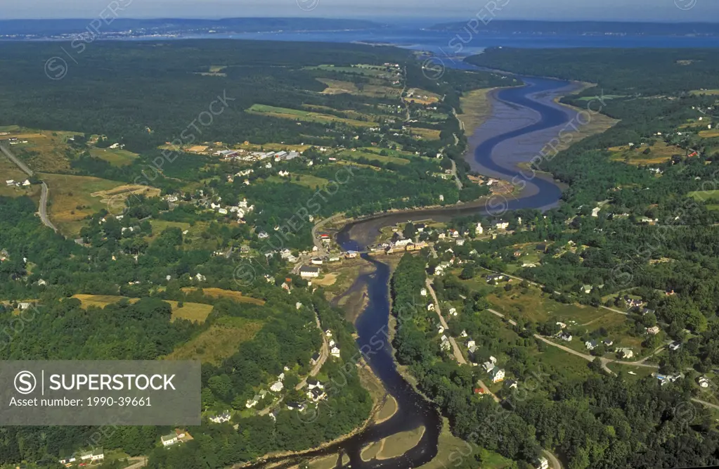 Water levels of Bear River, draining into Annapolis Basin & Bay of Fundy, rise and fall daily with Fundy tide. Nova Scotia, Canada.