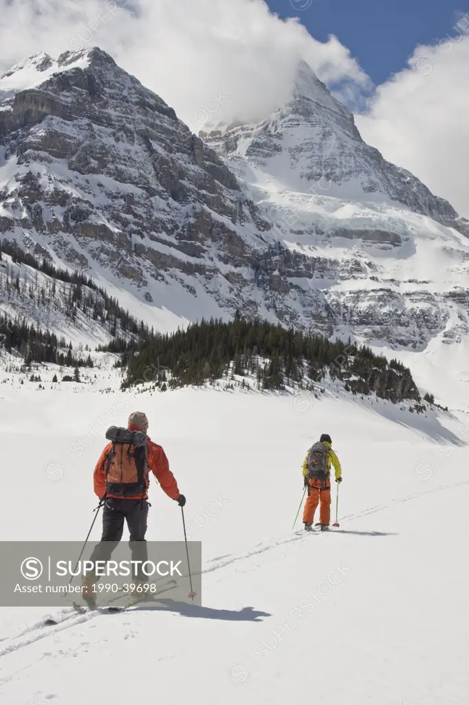 Two people cross_country skiing, Mount Assiniboine, Mount Assiniboine Provincial Park, British Columbia, Canada