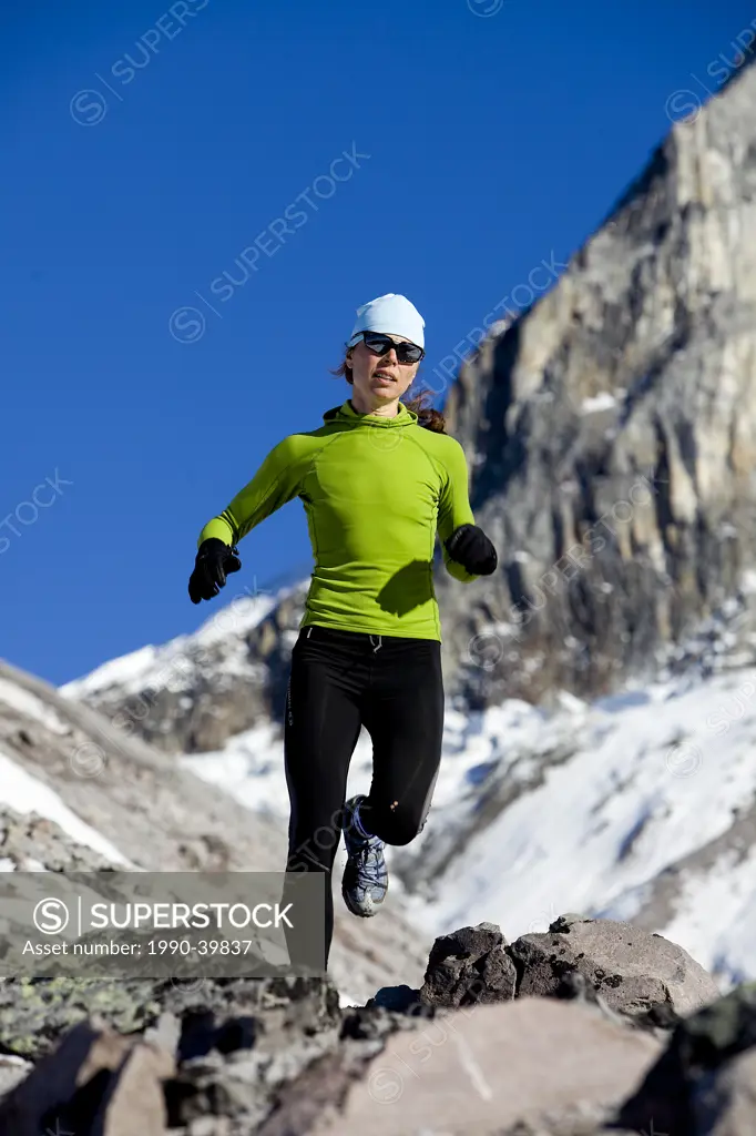 Woman trail running on Brohm Ridge near Squamish, British Columbia, Canada.