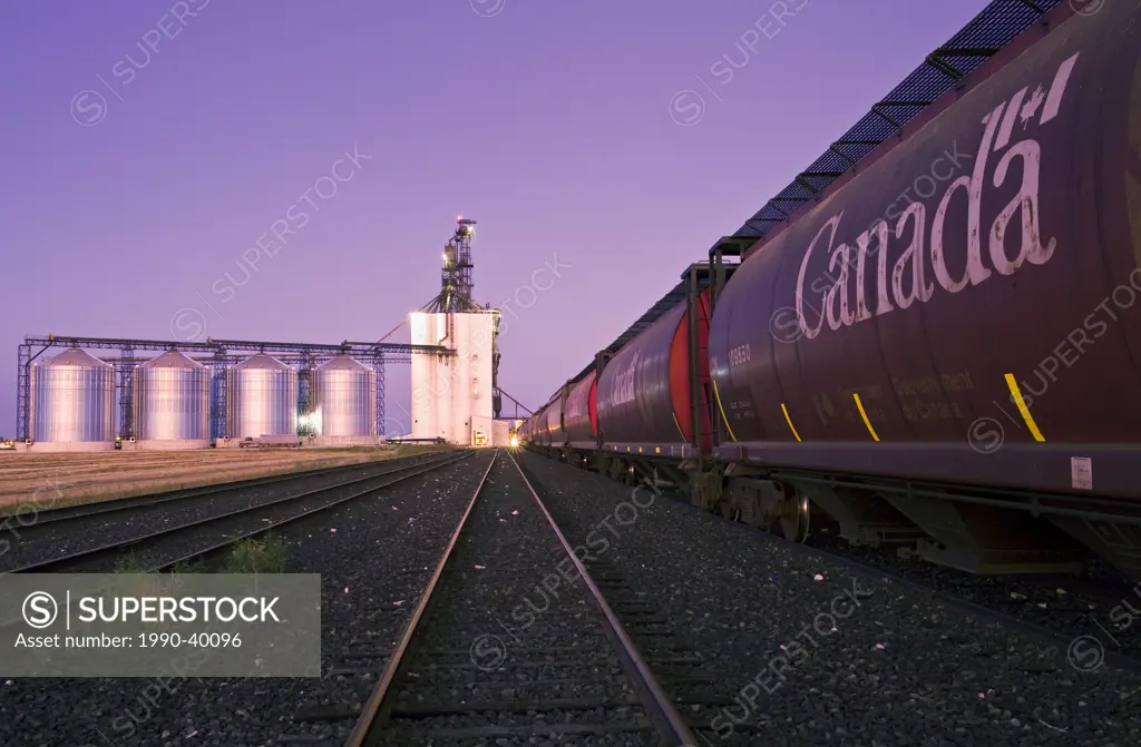 inland grain terminal with rail hopper cars in the foreground, Morris, Manitoba, Canada