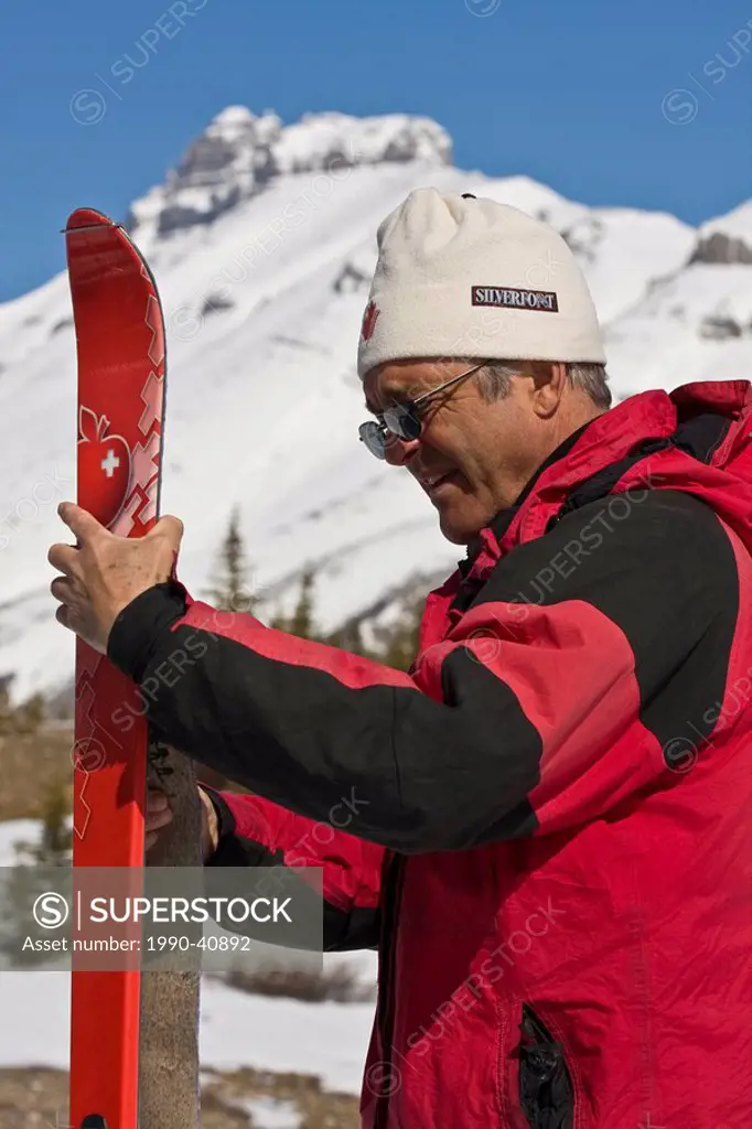 Man with skis, Parker Ridge, Banff National Park, Alberta, Canada