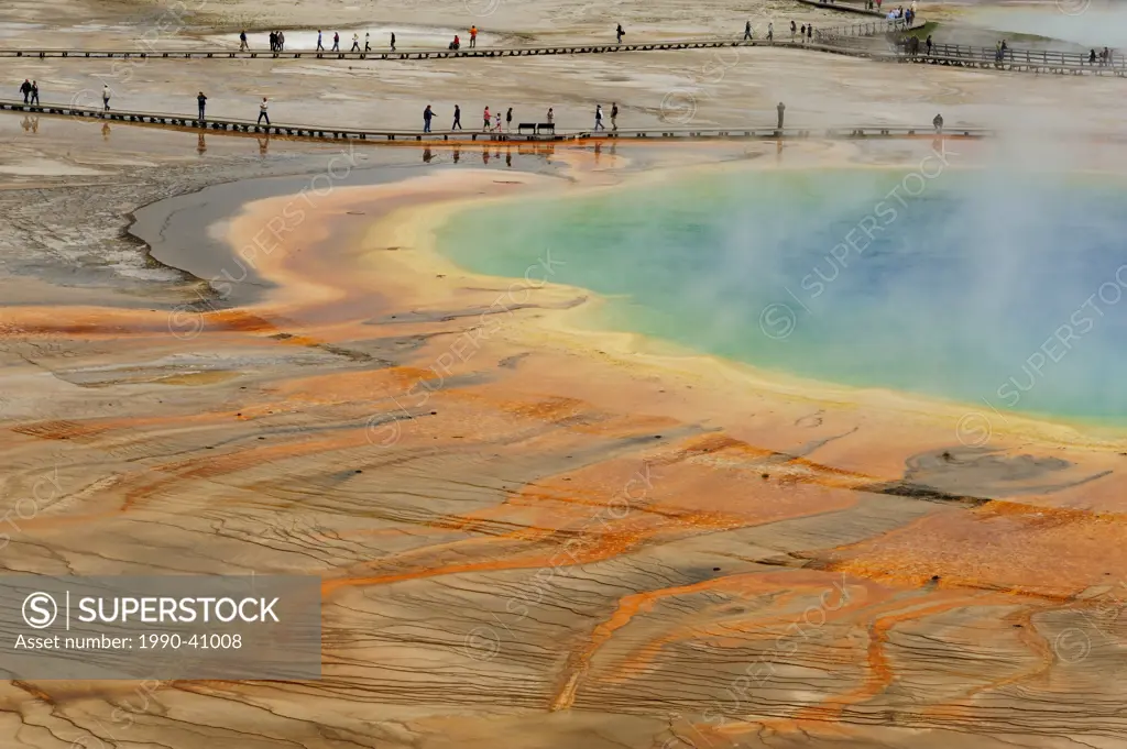 Visitors and boardwalks at Grand Prismatic Spring. Yellowstone National Park, Wyoming, United States of America.