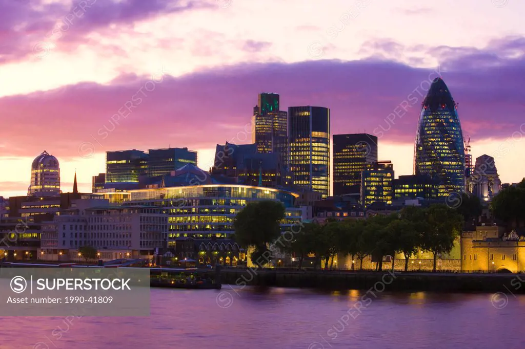 Office Buildings along the Thames River at Dusk, London, England, United Kingdom.