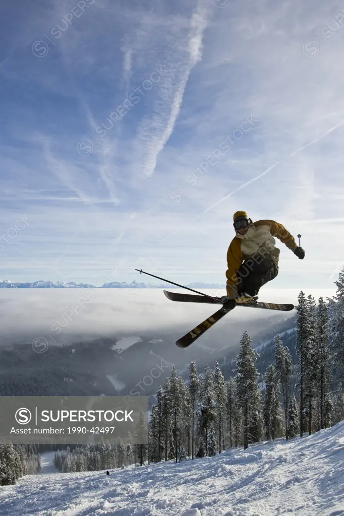 Tyler Ricketts catches air while skiing the bumps at Kimberley Alpine Resort, British Columbia, Canada. model release 07120