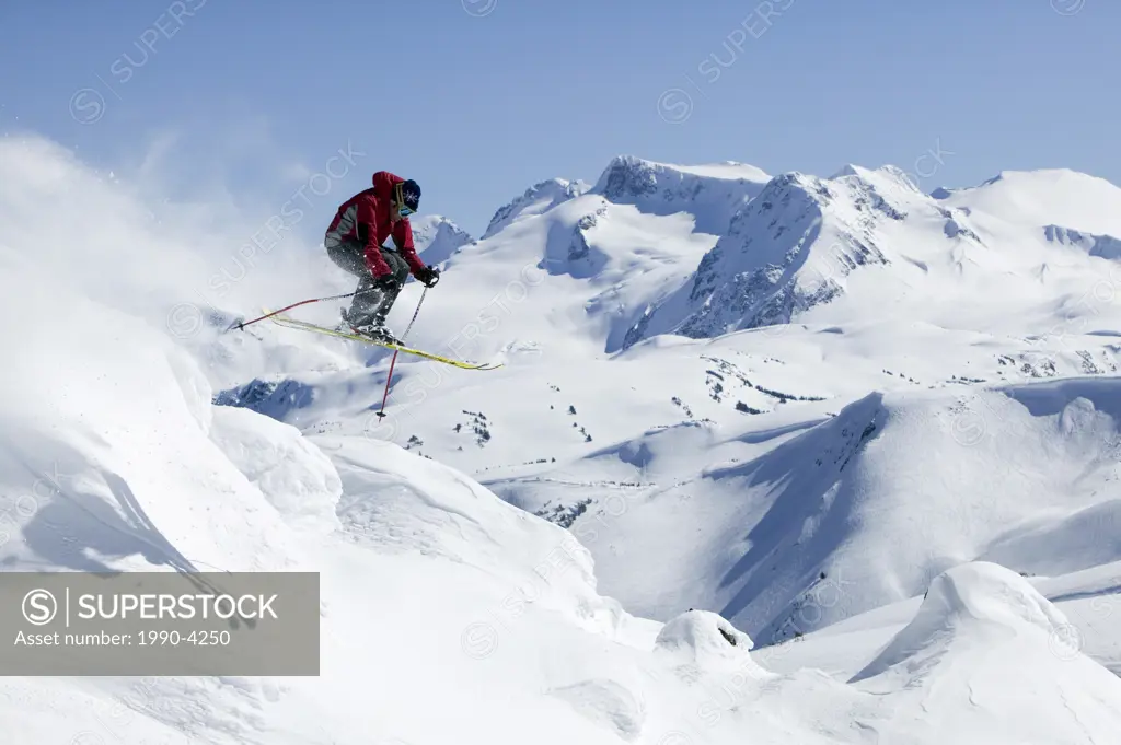 Skier getting air in Whistlers backcountry, British Columbia, Canada