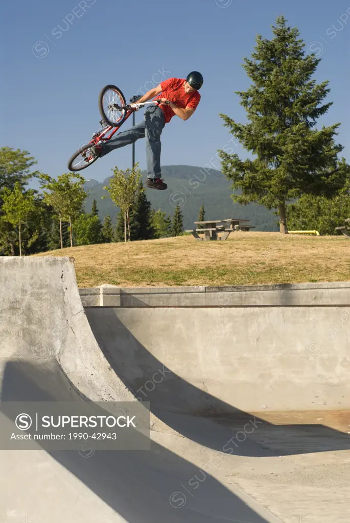 BMXer with a can_can air on the quarter at Lafarge Skatepark, Coquitlam, BC, Canada.