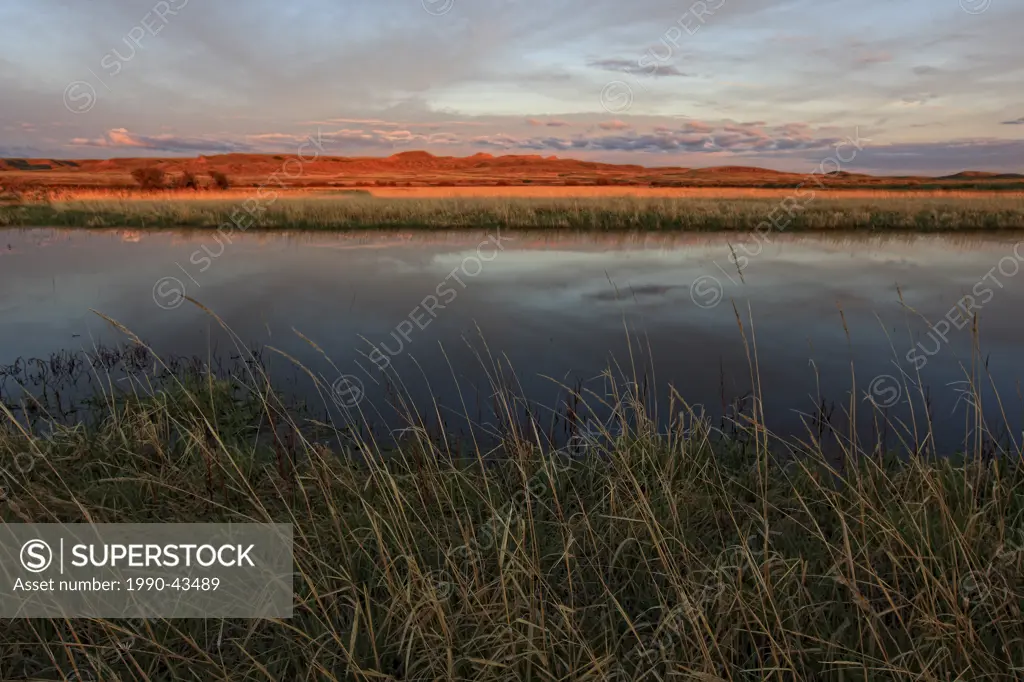 Sunsrise over a pond in Grasslands National Park, Saskatchewan.