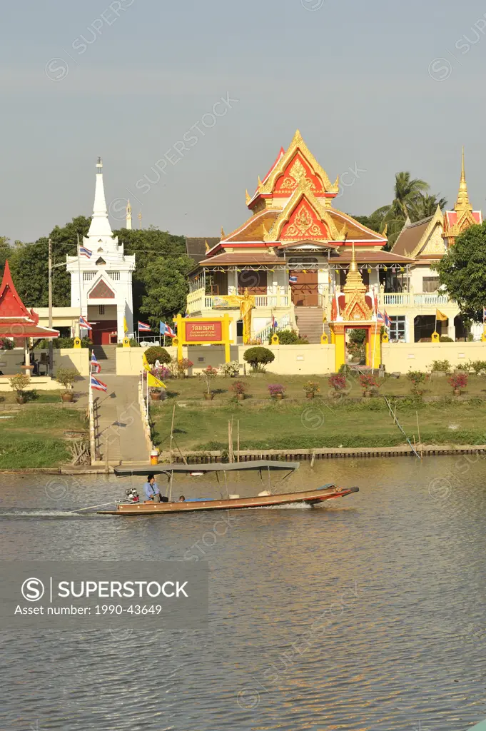 longtail sampan in Pa Sak River with Wat Monthop, Ayutthaya, Thailand