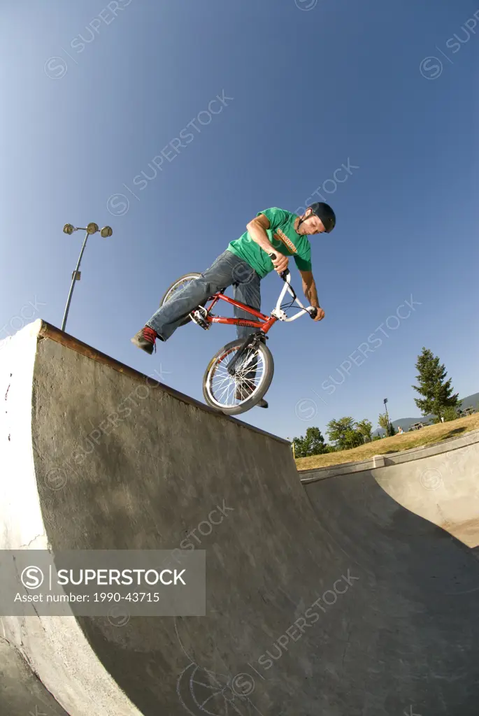 BMXer with a no_footed Canadian nosepick at Lafarge Skatepark, Coquitlam, BC, Canada.