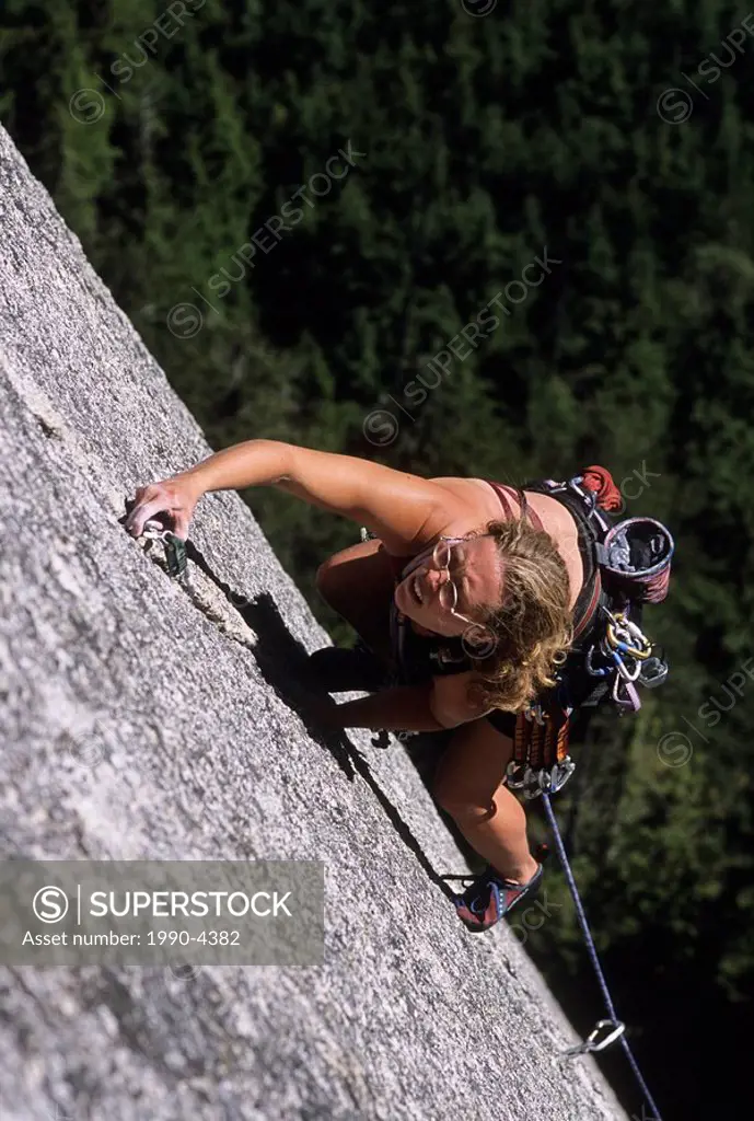 Woman climbing Sunblessed, 5.10, The Solarium, Stawamus Chief, Squamish, British Columbia, Canada.