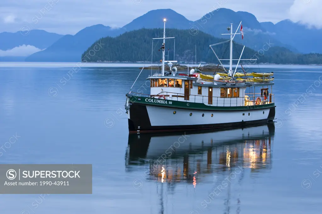 The MV Columbia III anchored for the night within the Broughton Archipelago exudes a warmth from interior lighting as evening sets in. Broughtin Archi...