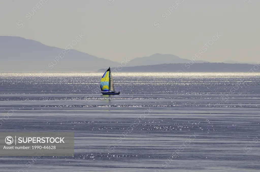 Sailboat sailing in the Strait of Georgia near Vancouver, British Columbia, Canada.