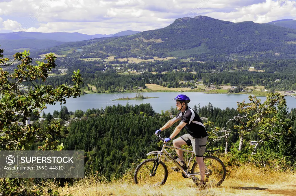 Man enjoying the views while mountain biking on Mt. Tzouhalem with Mt. Prevost in the background in Duncan, British Columbia,Women shopping in downtow...