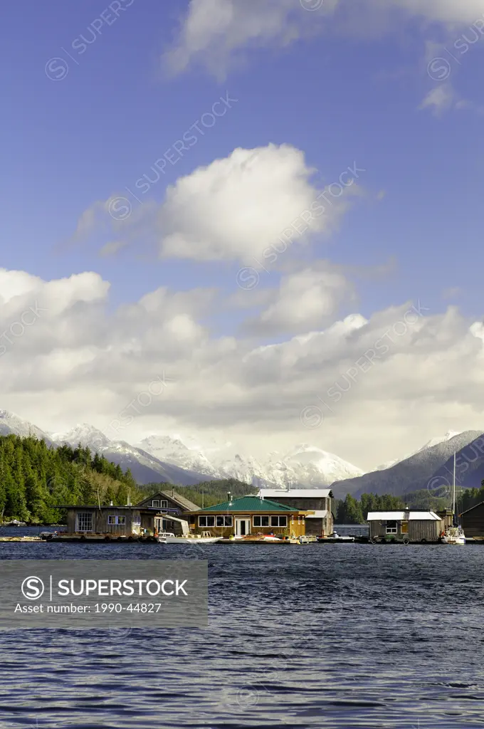 Sail boats and float houses in the harbour in Tofino, British Columbia, Canada.